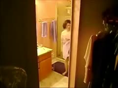 My ex-horny white wife is shown in a hidden camera video having a shower and undressing.